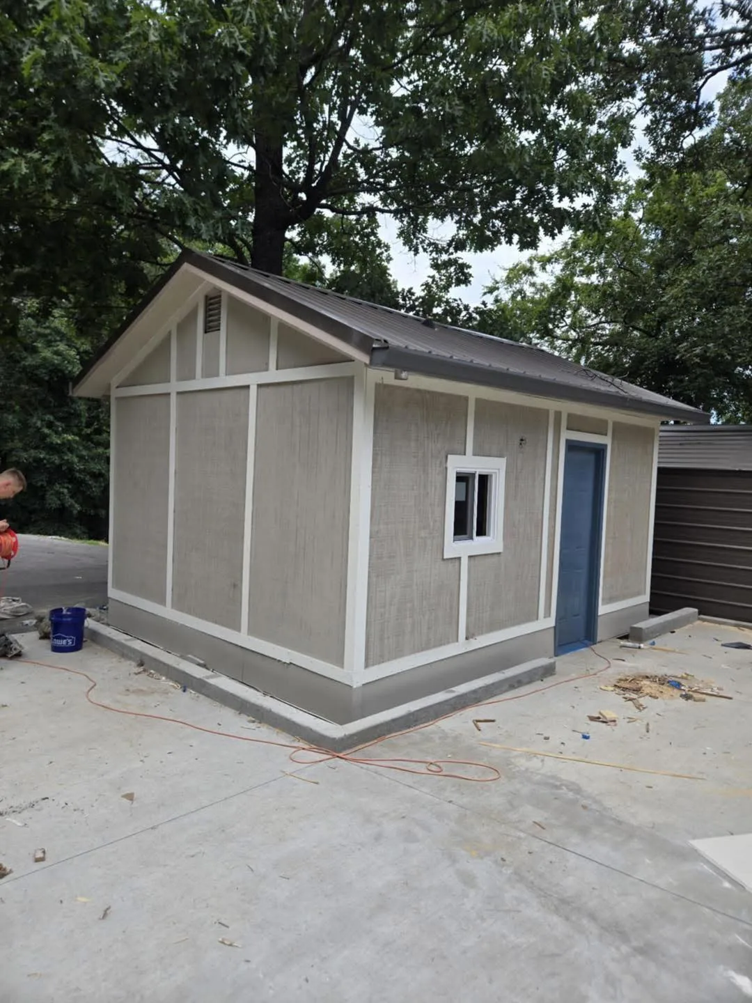 Custom outbuilding under construction with metal roof framing